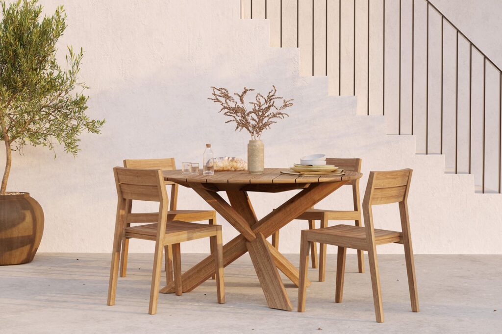 Round teak garden table set with four chairs, minimalist outdoor furniture handcrafted in Jepara