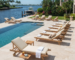 Commercial teak sun loungers set for a luxury hotel pool deck project from Indonesia furniture manufacturer.