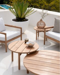 Teak coffee tables and outdoor lounge chairs for hospitality spaces